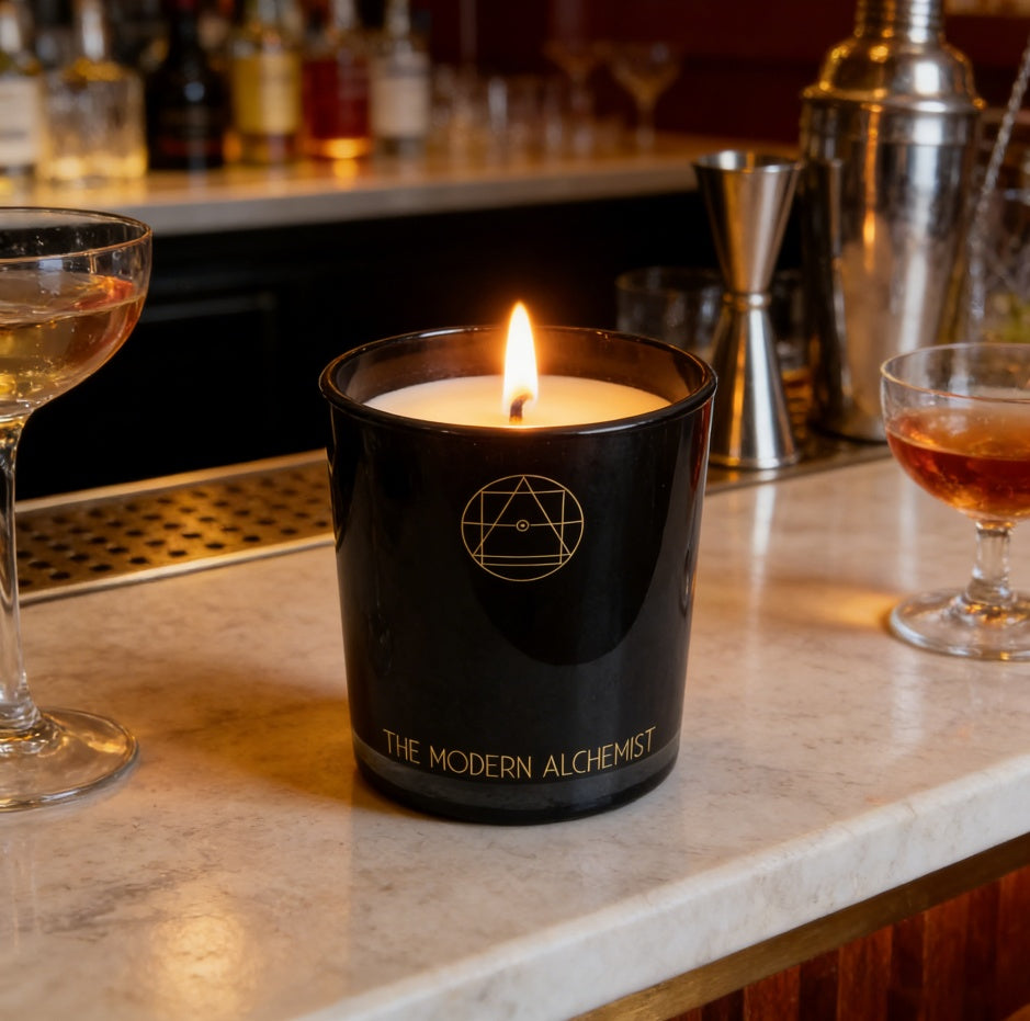 The Firelight Hour candle burning beside a warm hearth