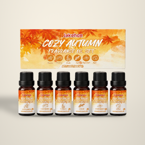 Autumn Hearth diffuser oil set, six amber bottles with gift box, on a warm cream backdrop