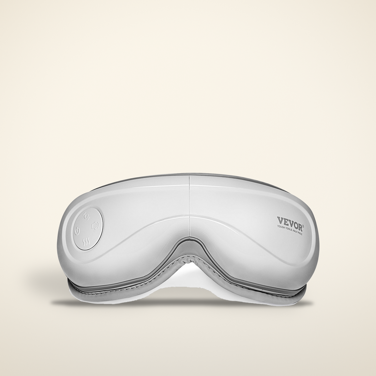 Heated eye massager on a warm candlelight cream background