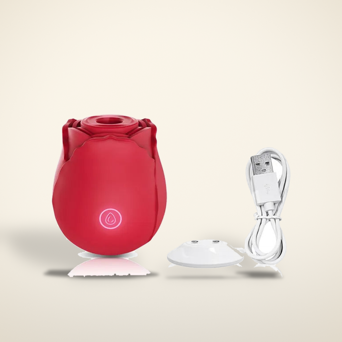 The Rose personal massager in red with its charging cable on a warm candlelight cream background