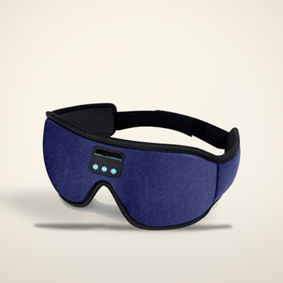Navy Bluetooth blackout sleep mask on a warm candlelight cream background